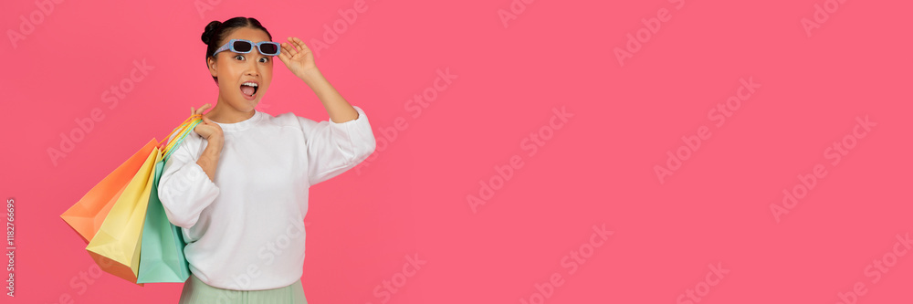 Beautiful Asian Woman With Bright Shopping Bags Taking Off Sunglasses And Looking At Camera, Smiling Young Lady Carrying Purchases, Enjoying Big Sales, Standing Over Pink Background, Copy Space Beautiful Asian Woman With Bright Shopping Bags Taking Off Sunglasses And Looking At Camera, Smiling Young Lady Carrying Purchases, Enjoying Big Sales, Standing Over Pink Background, Copy Space