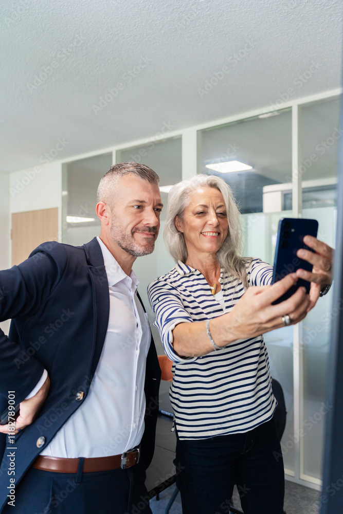 Colleagues Taking a Selfie Together in Office Setting Colleagues Taking a Selfie Together in Office Setting