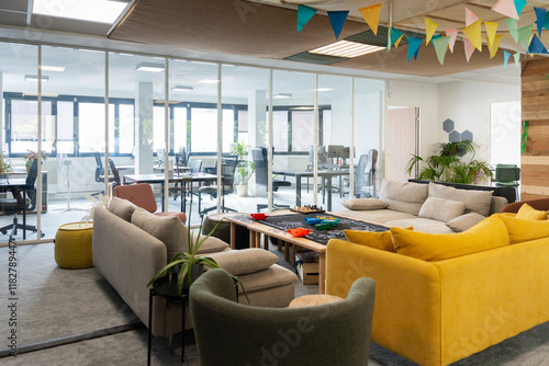 Inviting Co-Working Lounge With Puzzle Table and Glass Partition