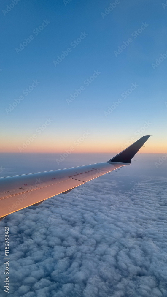 Obraz premium Sunset sky on airplane, plane window, evening flight for relax in holiday