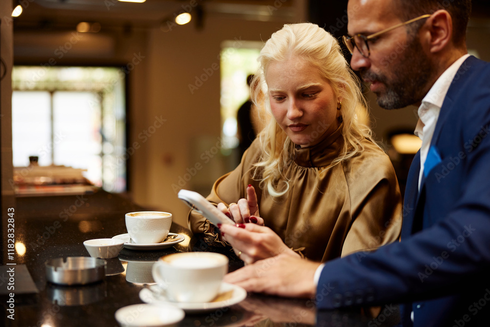 Colleagues enjoys coffee together Colleagues enjoys coffee together