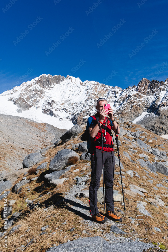 Hiker Taking a Photo in the Mountains Hiker Taking a Photo in the Mountains