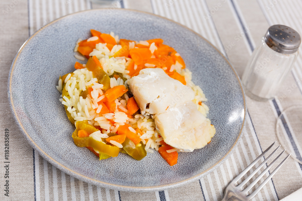Appetizing cod fish with rice and vegetables served on platter Appetizing cod fish with rice and vegetables served on platter