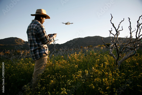 A drone photographer surveys land for smart farming. photo