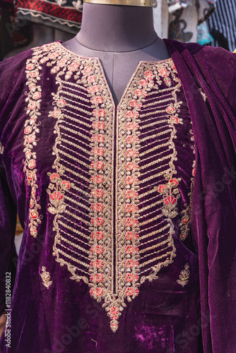 Bohri Kadal, Srinagar, Jammu and Kashmir, India. Traditional women's dress for sale at a market. photo