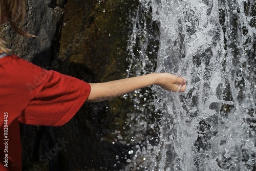 Touching nature's pure water flow photo