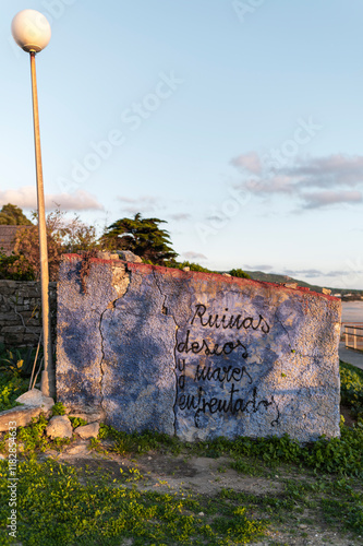 Graffiti on coastal ruins photo