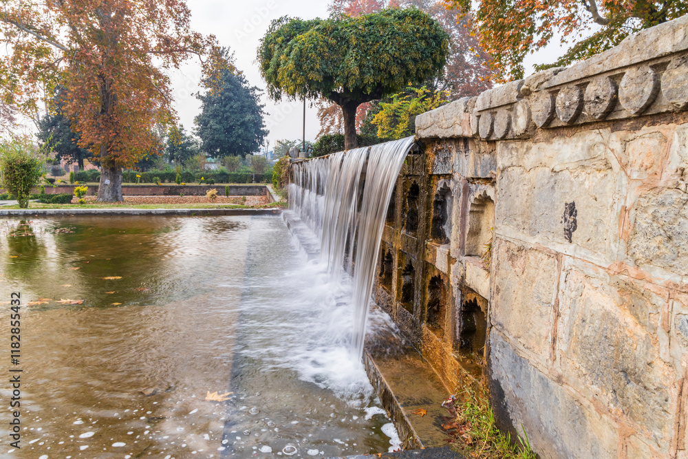 Srinagar, Jammu and Kashmir, India. Artificial waterfall in Mughal Garden. Srinagar, Jammu and Kashmir, India. Artificial waterfall in Mughal Garden.