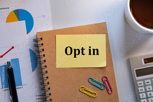 There is sticky note with the word Opt in. It is as an eye-catching image. photo