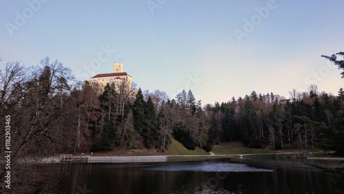 Obraz na płótnie Beautiful winter scenery of Trakošćan Castle on the hill by the lake in the forest at Croatia, county hrvatsko zagorje, nature background w salonie