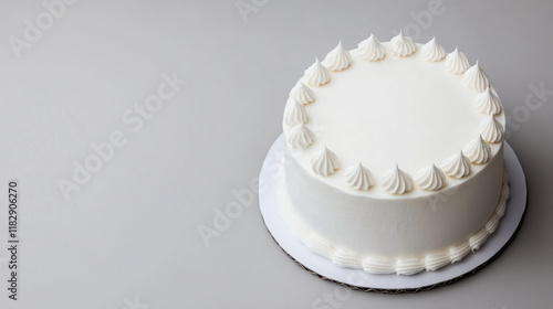 plain white birthday cake with elegant frosting swirls on top, perfect for celebrations