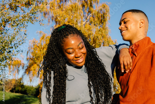 Couple of friends laughing and having fun together during an outing photo