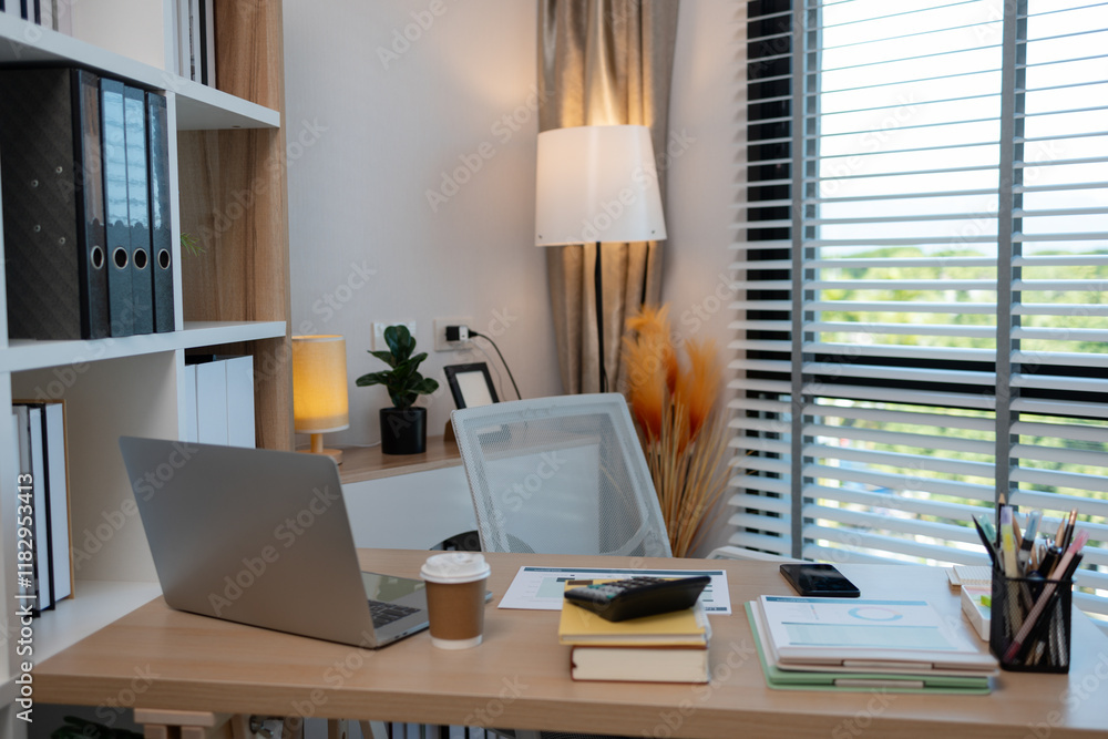 A sunlit office desk with an open laptop, productive workspace environment, cozy office with a stylish wooden desk, modern office space and professional work environment. A sunlit office desk with an open laptop, productive workspace environment, cozy office with a stylish wooden desk, modern office space and professional work environment.