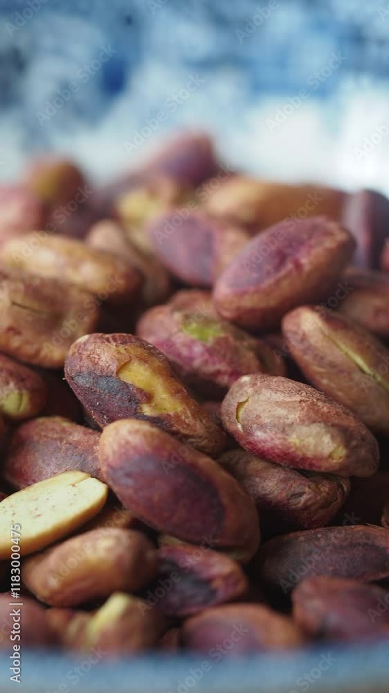 A closeup view Raw Pistachio Nuts in a bowl A closeup view Raw Pistachio Nuts in a bowl