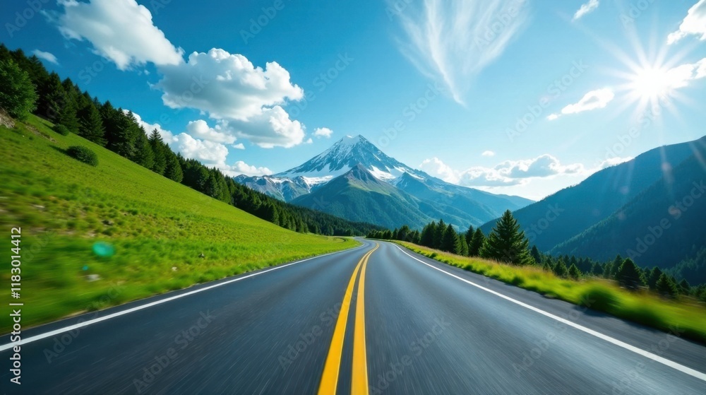 Fototapeta premium Asphalt Road Winding Through Majestic Mountain Landscape Under a Bright Sunny Sky