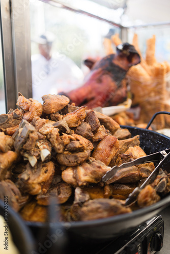 Serving fried pork meat during hispanicity day parade. Dia de la hispanidad photo