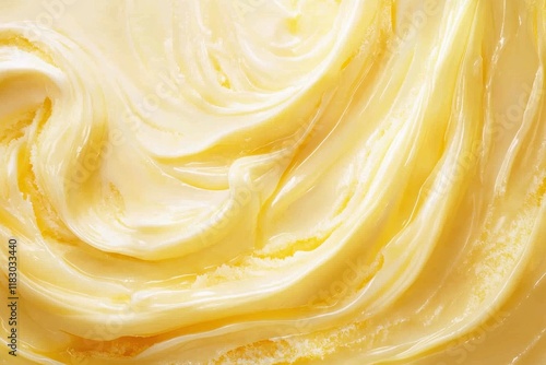 Close-up of creamy, yellow butter swirls. Perfect for food blogs, recipes, or dairy product ads. photo