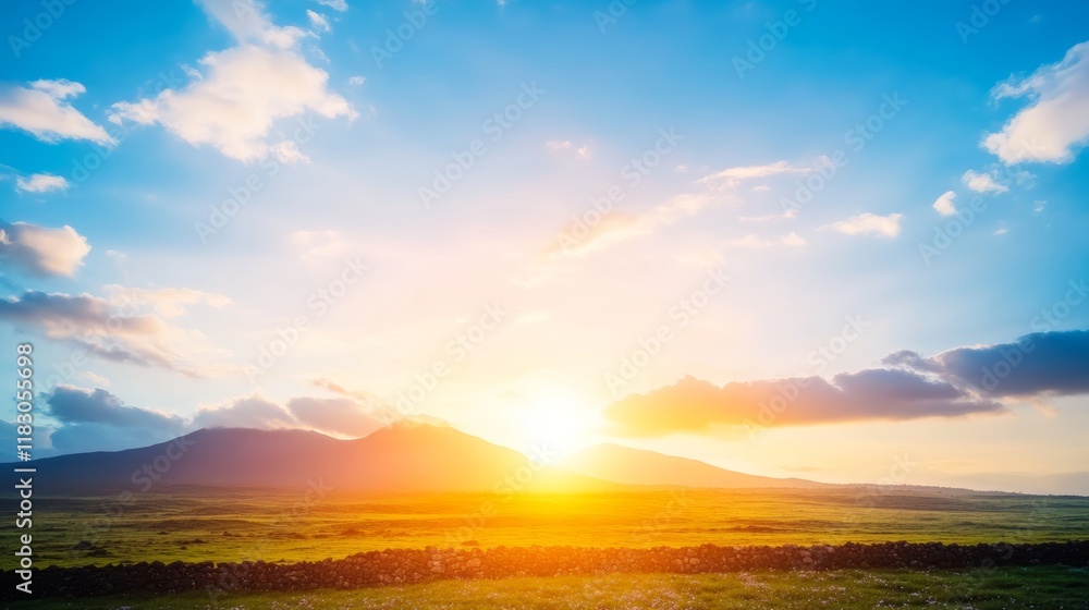 Fototapeta premium Serene Sunset Over Rolling Green Hills and Distant Mountains