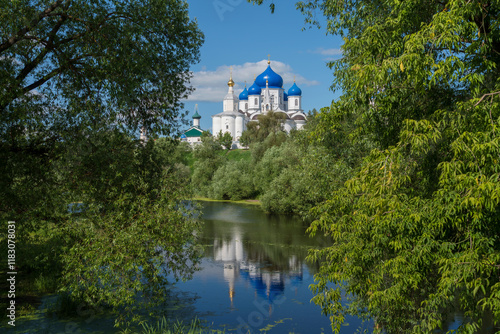 Bogolyubsky Monastery of the Nativity of the Virgin is a female Orthodox monastery on the banks of the Monastic Pond on a sunny summer day, Bogolyubovo, Suzdal district, Vladimir region, Russia photo