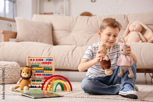 Cute little boy playing wit...
