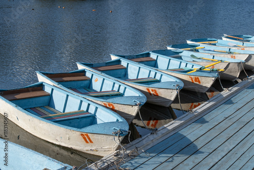 Wallpaper Mural Worn-out boats are moored at the city pond. Torontodigital.ca
