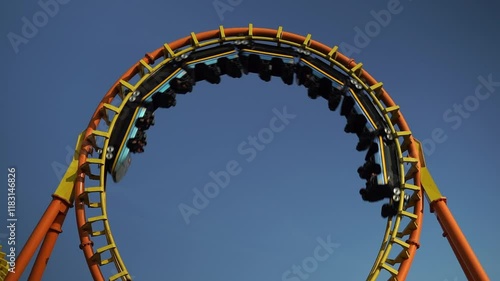 Roller coaster Ride against Roller coaster in the amusement park.