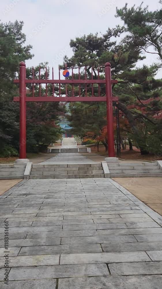 Front view of Hongsalmun Gate with pine trees against Chunguimun Gate of Hyeonchungsa Shrine Front view of Hongsalmun Gate with pine trees against Chunguimun Gate of Hyeonchungsa Shrine