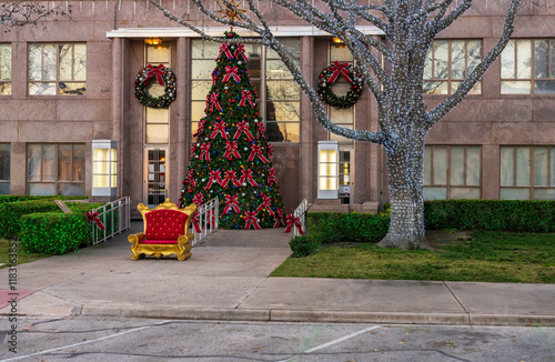 Lights on trees with large Xmas tree at entrance to the historic Burnet County court house in Texas photo