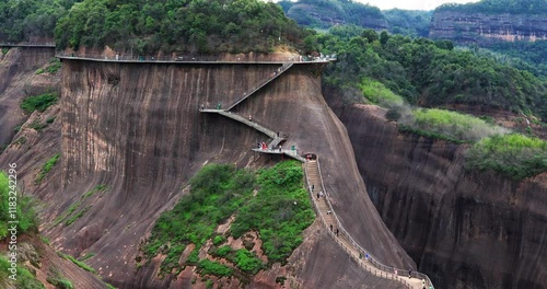 Gaoyi Ridge(Gaoyiling) Scenic Area is located in Chenzhou City of Hunan Province, which is dominated by Danxia landform. Visitors can enjoy the unique landscape of red rocks, green water and streams.