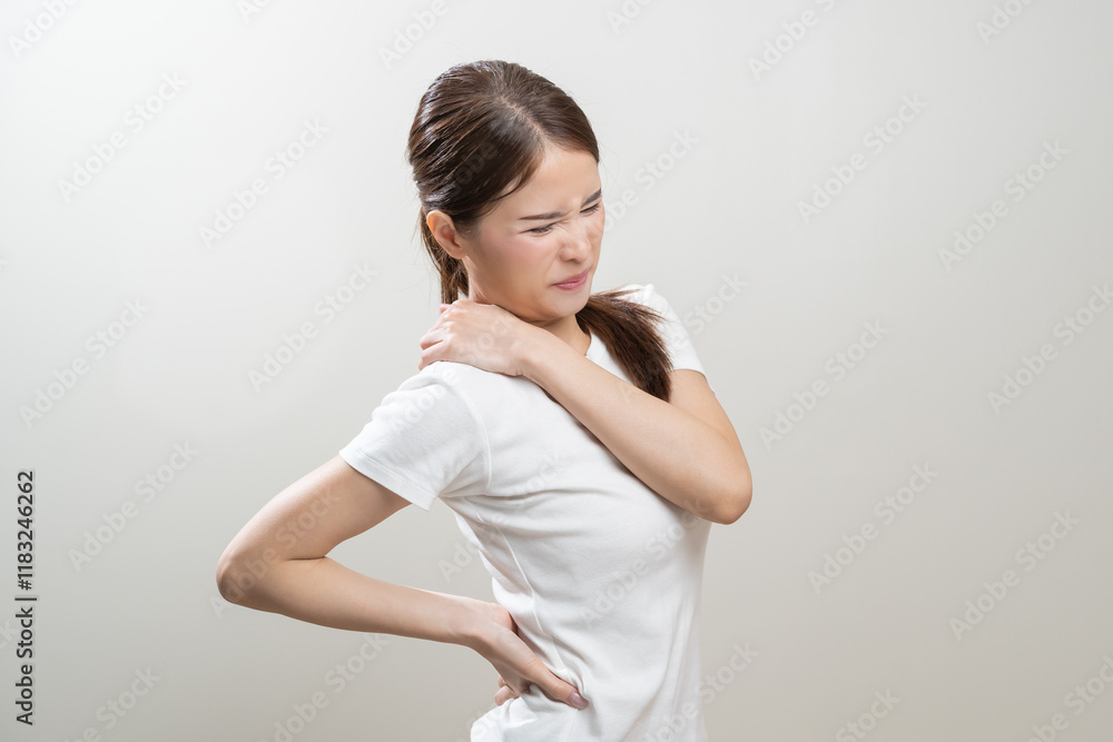 Pain body muscles stiff problem, asian young woman, girl painful with back, neck ache from work hand holding massaging rubbing shoulder hurt, sore on white background. Health care and medicine concept Pain body muscles stiff problem, asian young woman, girl painful with back, neck ache from work hand holding massaging rubbing shoulder hurt, sore on white background. Health care and medicine concept