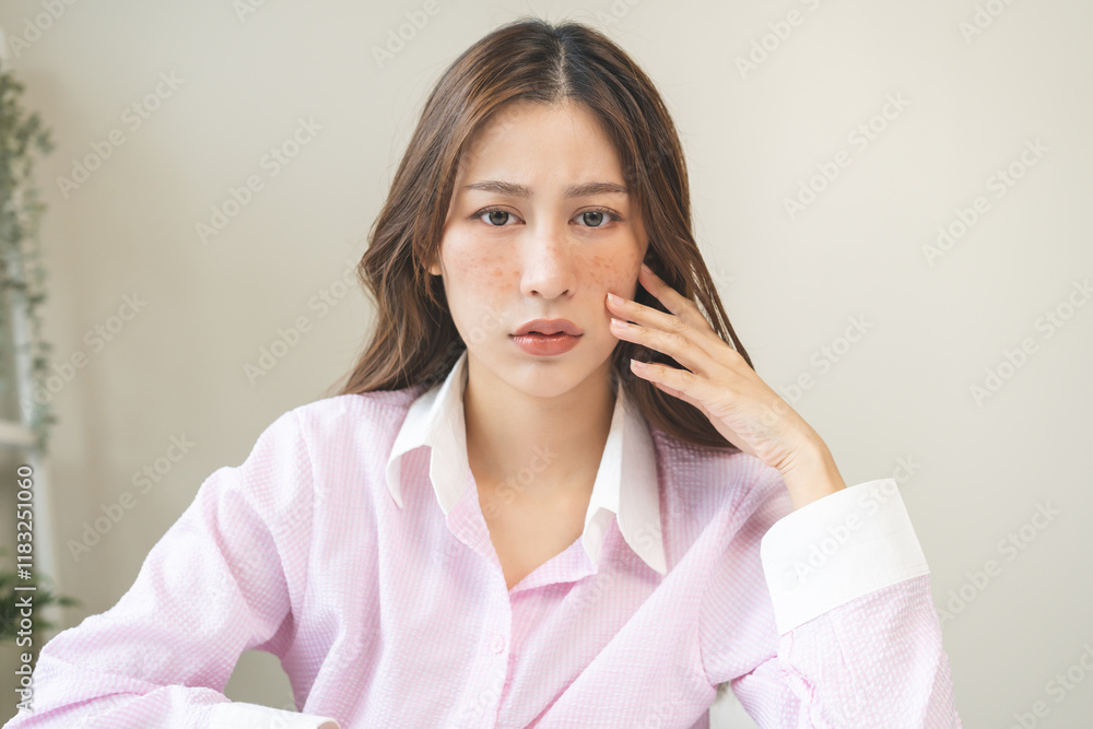 Dermatology, expression face worry, stressed asian young woman hand touching facial at dark spot of melasma, freckles from pigment melanin, allergy sun. Beauty care, skin problem treatment, skincare. Dermatology, expression face worry, stressed asian young woman hand touching facial at dark spot of melasma, freckles from pigment melanin, allergy sun. Beauty care, skin problem treatment, skincare.