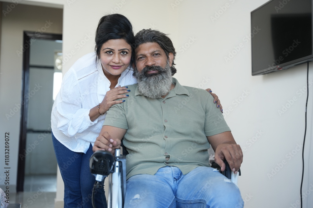 indian wife taking care of husband on wheel chair at home. handicapped or disability concept. indian wife taking care of husband on wheel chair at home. handicapped or disability concept.