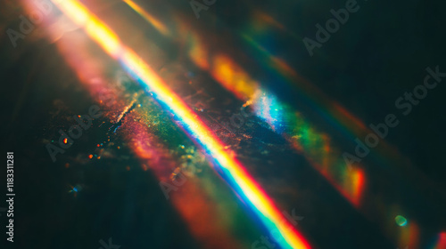 Prismatic light leaks with rainbow bokeh on dark background