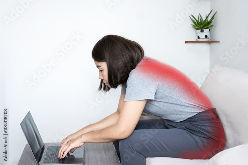 slouching position concept with Asian woman hunching her back at  computer desk and sitting in bad posture