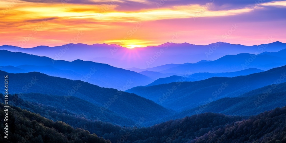 Fototapeta premium Majestic sunset over the mountains creates a breathtaking view, showcasing the vibrant colors and tranquility of the mountains as the day comes to a close in a stunning display of nature.