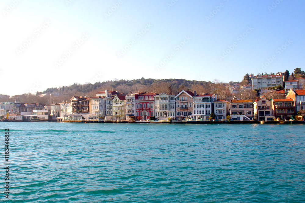 Obraz premium Panoramic view of Yeniköy coastline. Historical and colorful mansions on the shores of the Bosphorus. Touristic architectural buildings. 