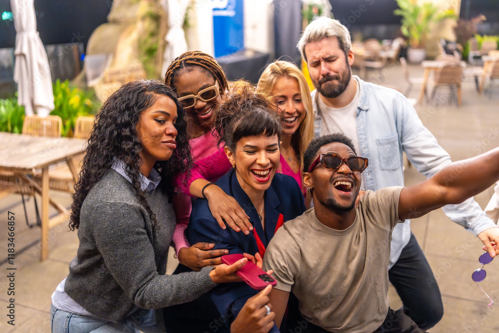 Fototapeta premium Happy group of multiracial friends taking selfie at night party