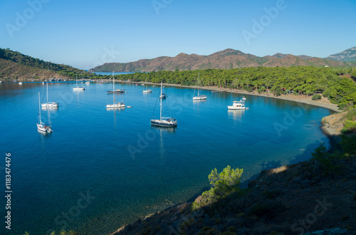 Fototapeta Naklejka Na Ścianę i Meble -  Beautiful Aktur beach. Sailboats and beautiful nature in a wonderful sea climate. Background for your holiday. Datca Peninsula, Aegean Region. Mugla city, Turkey country 
