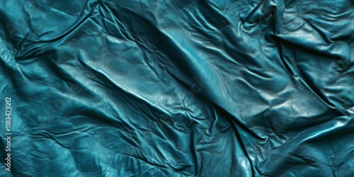 Crumpled greenish blue leather texture serves as an intriguing background, showcasing the unique patterns and tones of this striking greenish blue leather texture for creative designs. photo