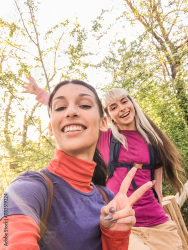 Hikers taking selfie, enjoying nature in the woods