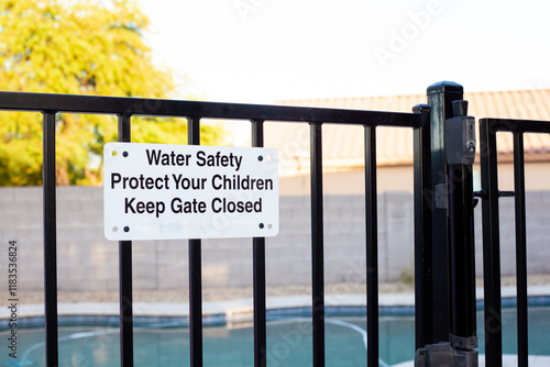 Konstfotografi Pool safety gate with sign emphasizing water safety