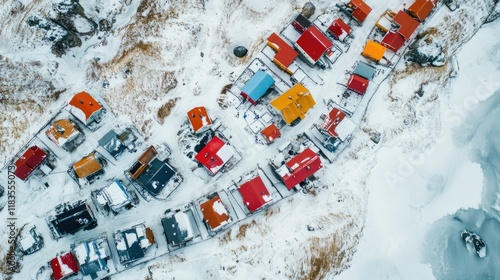 Remote Greenland village blanketed in snow, colorful houses contrasting against the icy landscape. photo