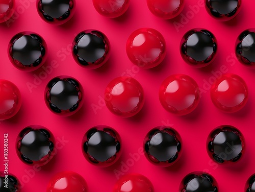 A vibrant display of red and black glossy spheres arranged in a neat grid on a bright pink background, creating a striking visual contrast. photo