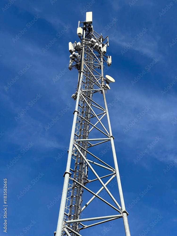 Mobil antenna tower against blue sky