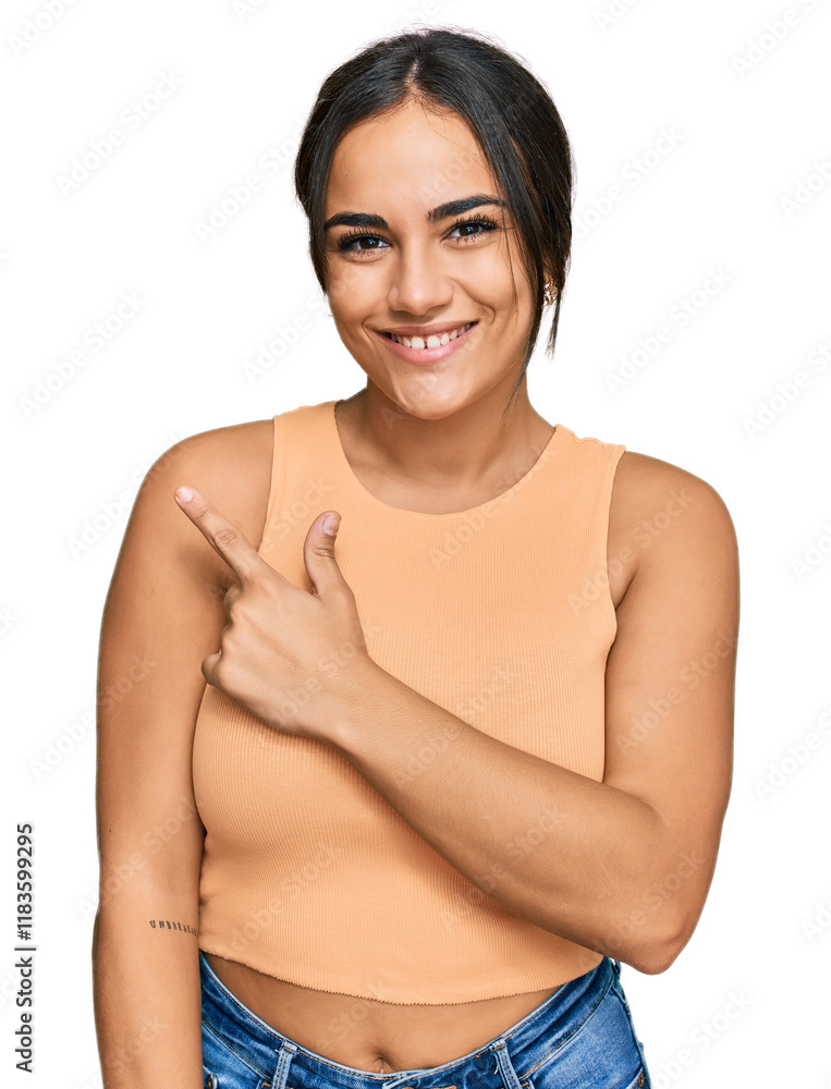 Fototapeta premium Young brunette woman wearing casual clothes cheerful with a smile of face pointing with hand and finger up to the side with happy and natural expression on face