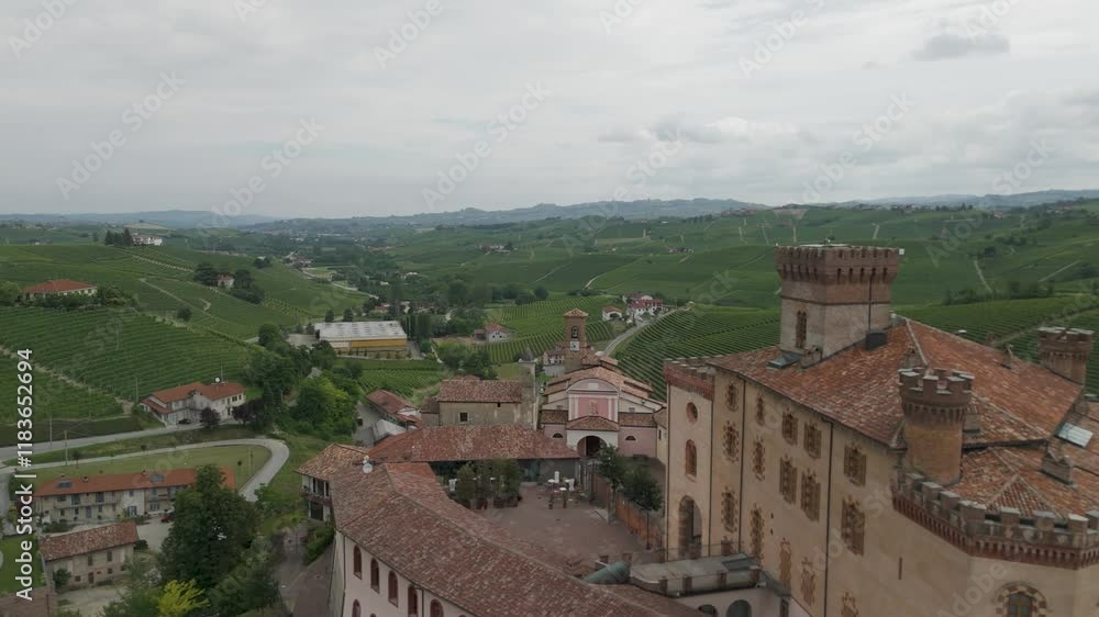 Barolo Castle in Langhe Wine Region, Cuneo, Piedmont, Italy. 4K Aerial view of the village and the vineyards, flying forward, close to the castle. Barolo Castle in Langhe Wine Region, Cuneo, Piedmont, Italy. 4K Aerial view of the village and the vineyards, flying forward, close to the castle.