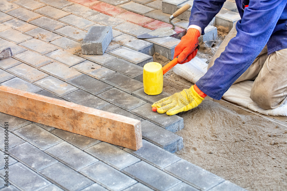 Crafting a beautiful stone pathway with care and precision in a sunny outdoor space