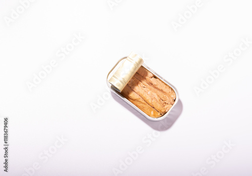 silver tin can, opened, canned fish, white background.