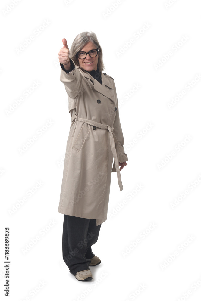 front view of a woman smiling with thumbs up and looking at camera on white background front view of a woman smiling with thumbs up and looking at camera on white background