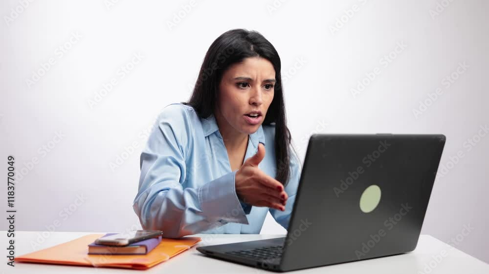Latin businesswoman arguing during video call in slow motion Latin businesswoman arguing during video call in slow motion